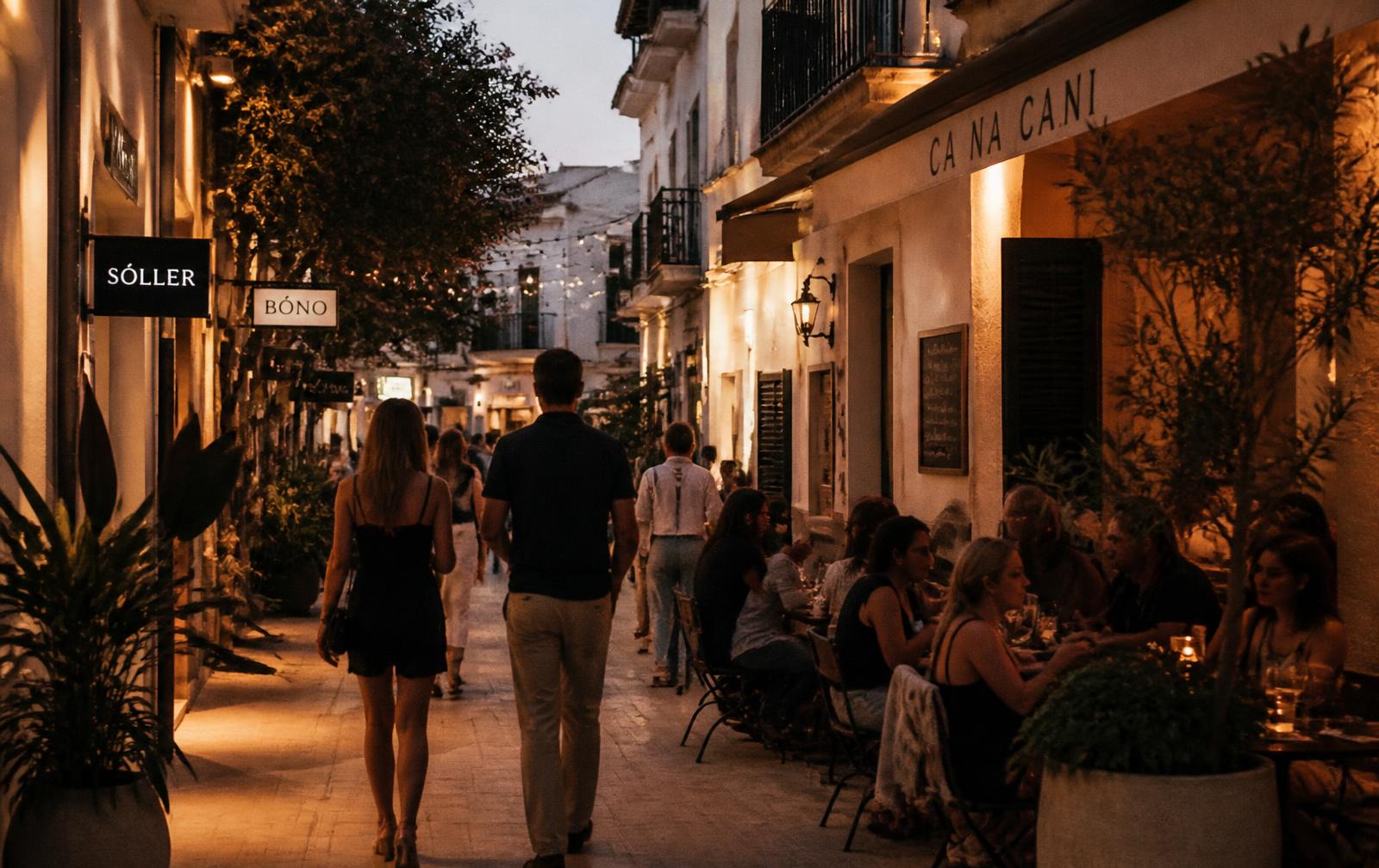 Walkable retail street at dusk with cafés and outdoor dining